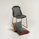 Three Cairngorm Shetland Tweed Cushions on a chair.