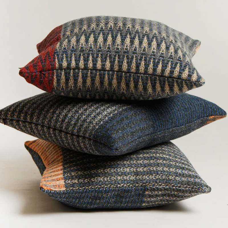 Three Cairngorm Shetland Tweed Cushions stacked.