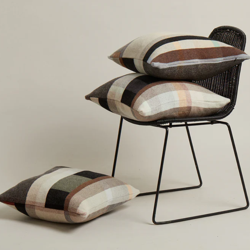 The Chipperfield Cushion from Wallace & Sewell on a chair.