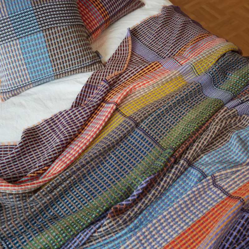 The Jankel Basket Throw ALT by Wallace & Sewell on a bed.