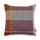 Wallace & Sewell’s Lovelace Basket Weave Cushion has colorful tones of red, orange, green, purple, brown, and light blue.