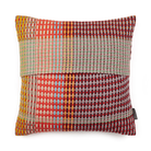 Wallace & Sewell’s Lovelace Basket Weave Cushion has colorful tones of red, orange, light green, purple, and light blue.