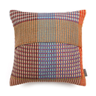 Wallace & Sewell’s Lovelace Basket Weave Cushion has colorful tones of red, orange, green, grey, and light blue.