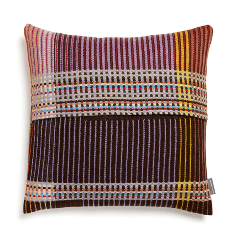 Wallace & Sewell's Pinstripe Sophia cushions feature detailed vertical stripes within areas of bold playful colors like purple, lilac, and yellow.