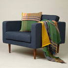 Wallace & Sewell’s Watson Throw in size large on an armchair.