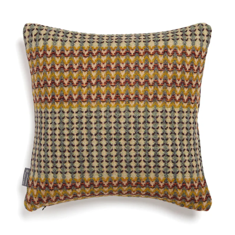 The Yosemite Cushion by Wallace & Sewell is made of Shetland Wool.Yellow and blue accents.