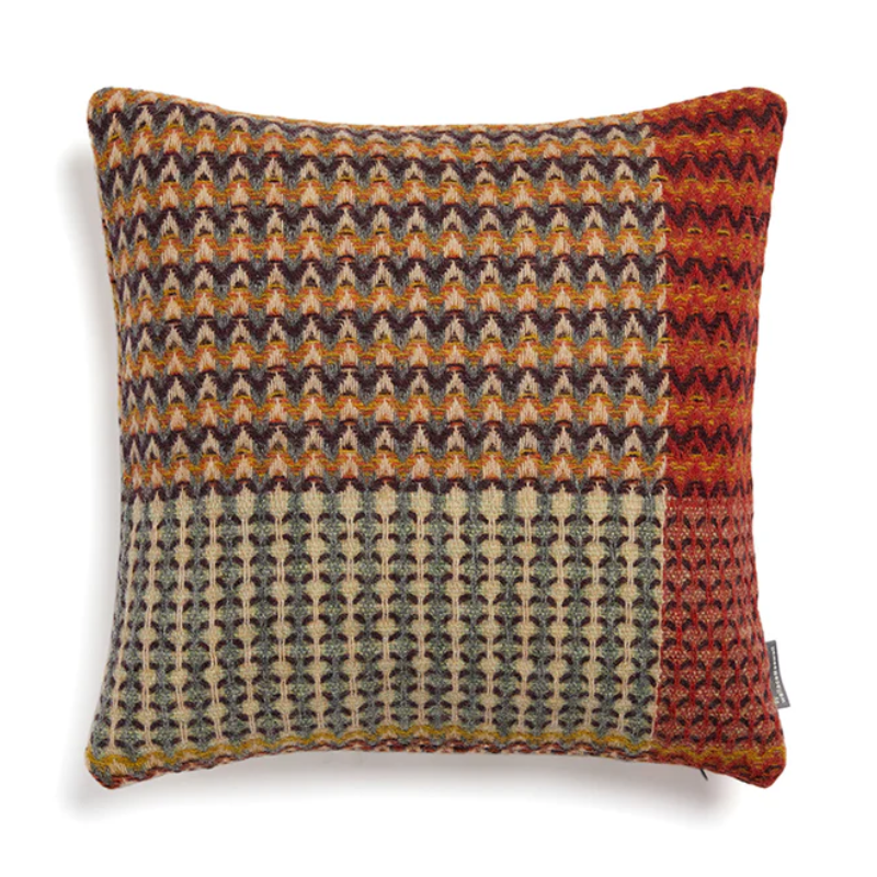 The Yosemite Cushion by Wallace & Sewell is made of Shetland Wool. Cushion with orange and red accents.