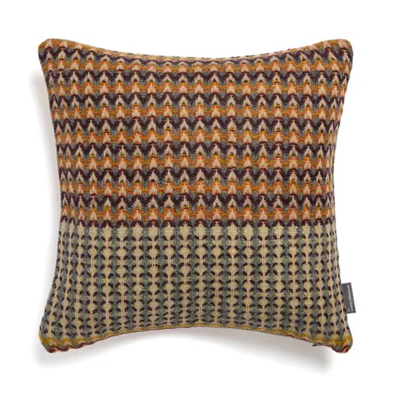 The Yosemite Cushion by Wallace & Sewell is made of Shetland Wool. Cushion with orange and green accents.