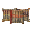 The Yosemite Cushion by Wallace & Sewell is made of Shetland Wool. Image shows three colorways of the same cushion.