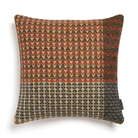 The Yosemite Cushion by Wallace & Sewell is made of Shetland Wool. Cushion with red and green accents.