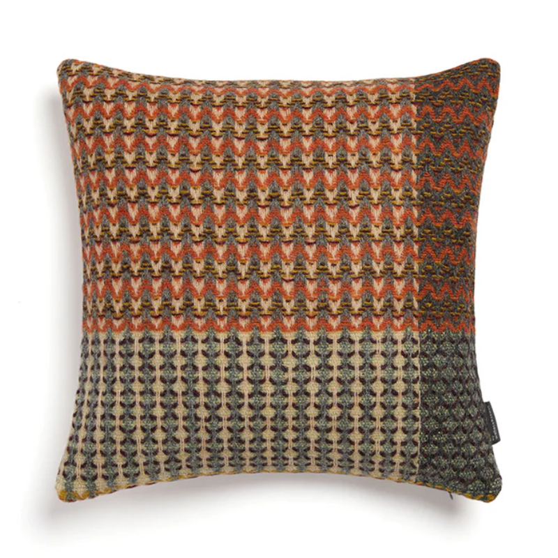 The Yosemite Cushion by Wallace & Sewell is made of Shetland Wool. Cushion with red and green accents.