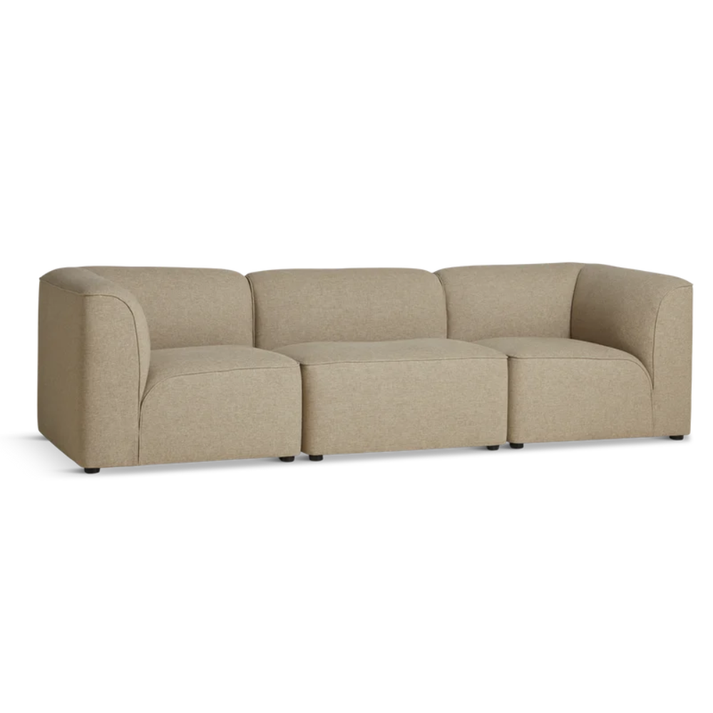 The Flora Sofa wide by Woud in warm beige.