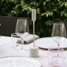 The pearl white Carolina Pro from Zafferano in an outdoor dining space.