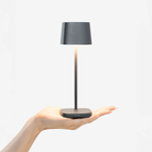 The dark gray Ofelia Pro Micro from Zafferano, a cordless lamp.