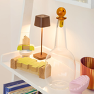 The rust Ofelia Pro Micro from Zafferano in a study room.