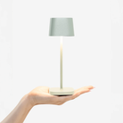 The sage Ofelia Pro Micro from Zafferano, a cordless lamp.
