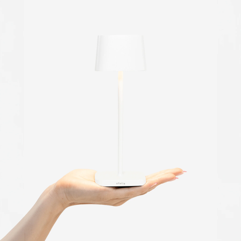 The white Ofelia Pro Micro from Zafferano, a cordless lamp.