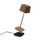 The rust Ofelia Pro cordless lamp from Zafferano, a portable light.