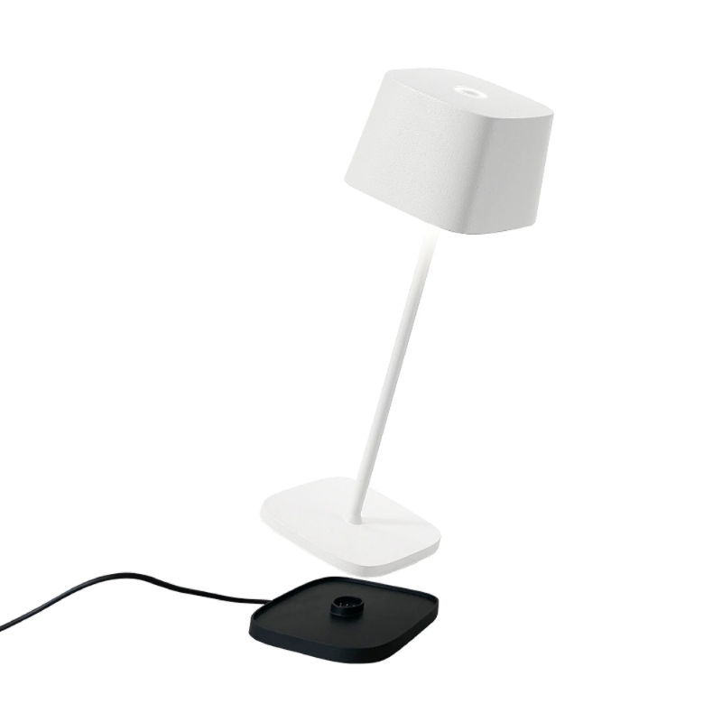 The white Ofelia Pro cordless lamp from Zafferano, a portable light.
