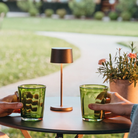 The rust Olivia Pro Micro from Zafferano in an outdoor lounge.