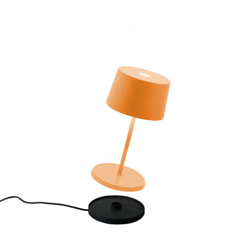 The orange Olivia Pro Mini from Zafferano, a portable lamp.