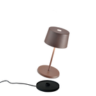 The rust Olivia Pro Mini from Zafferano, a cordless lamp.
