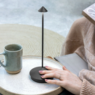 The dark gray Pina Pro from Zafferano in an outdoor lounge.