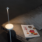 The white Pina Pro Floor Stand from Zafferano in a living room.