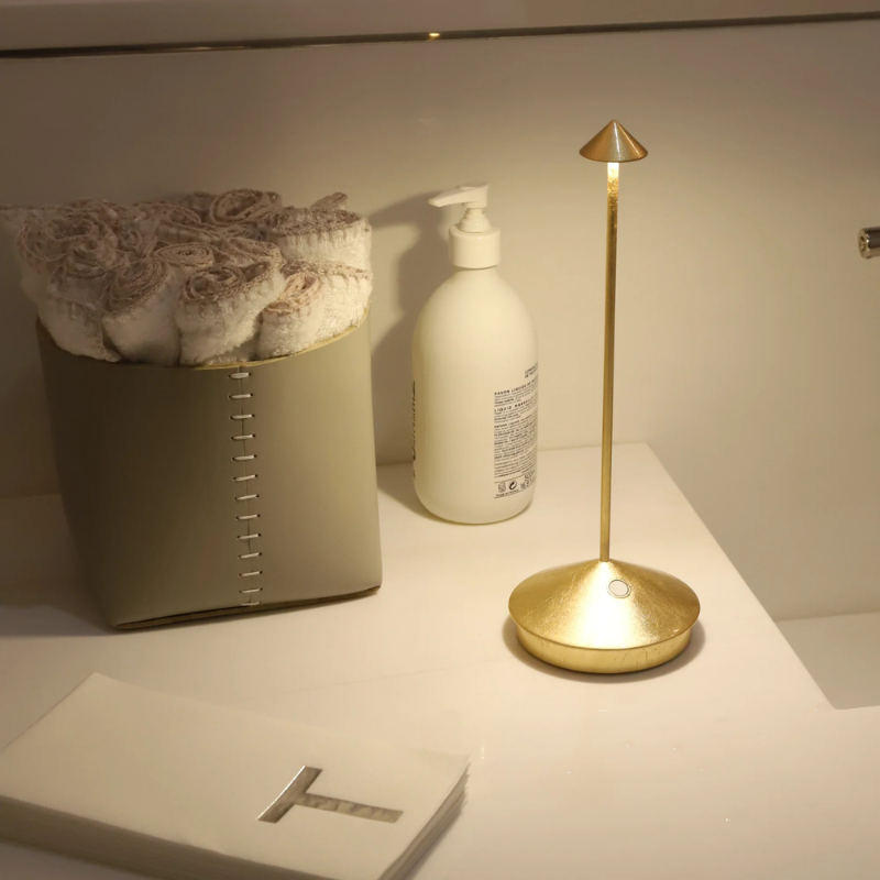 The gold leaf Pina Pro from Zafferano in a bathroom.