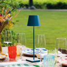 The avio blue Poldina Pro from Zafferano on an outdoor table.