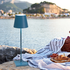 The avio blue Poldina Pro from Zafferano at a waterside picnic.