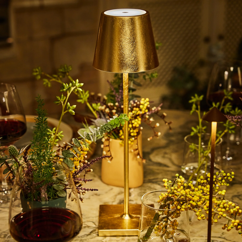 The gold leaf Poldina Pro from Zafferano in a dining room.