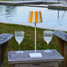 The Poldina Pro Lido with yellow stripes and white base from Zafferano in a outdoor living space.