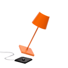 The orange Poldina Pro Mini from Zafferano, a cordless lamp.