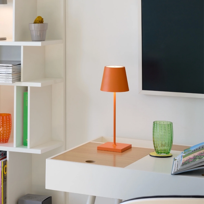 The orange Poldina Pro Mini from Zafferano in a family space.