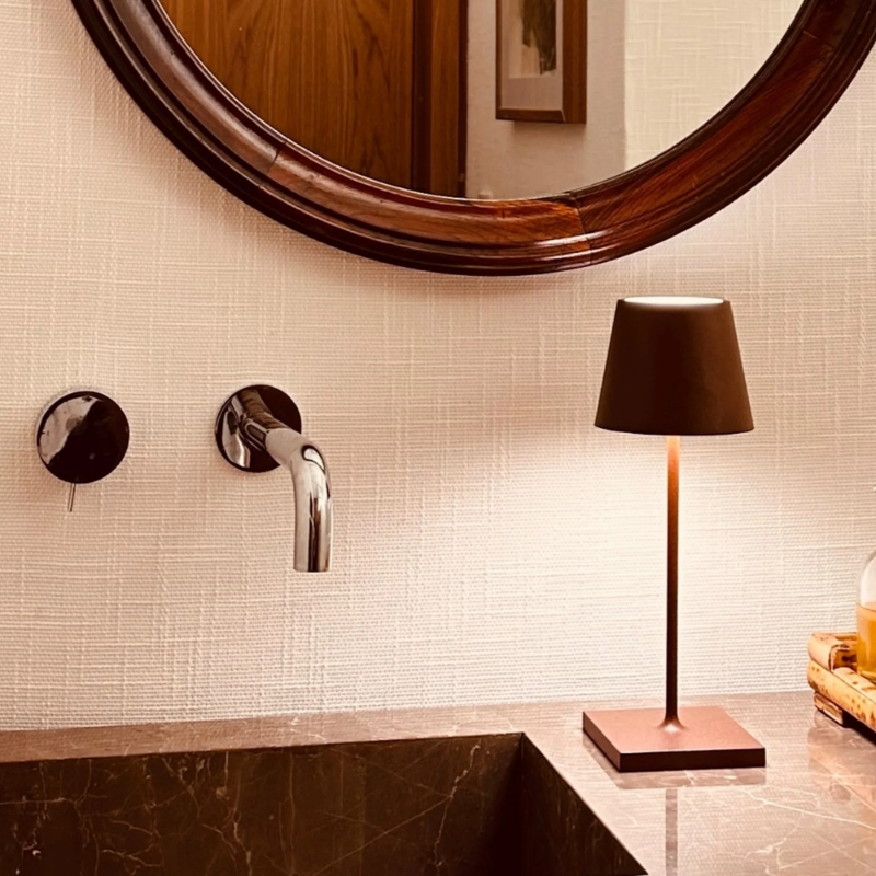 The rust Poldina Pro Mini from Zafferano in a bathroom.