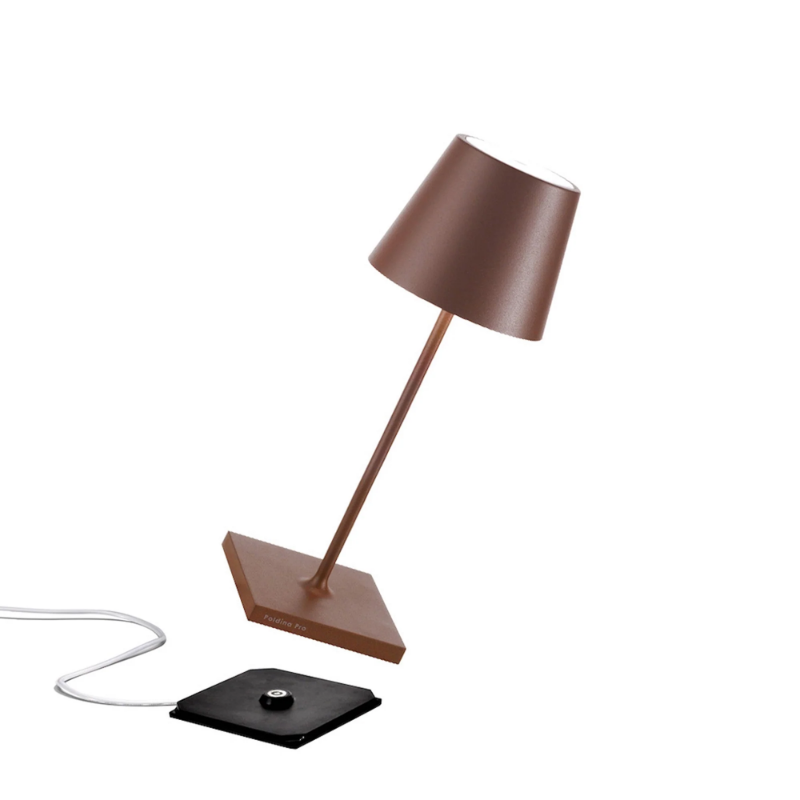 The rust Poldina Pro Mini from Zafferano, a cordless lamp.