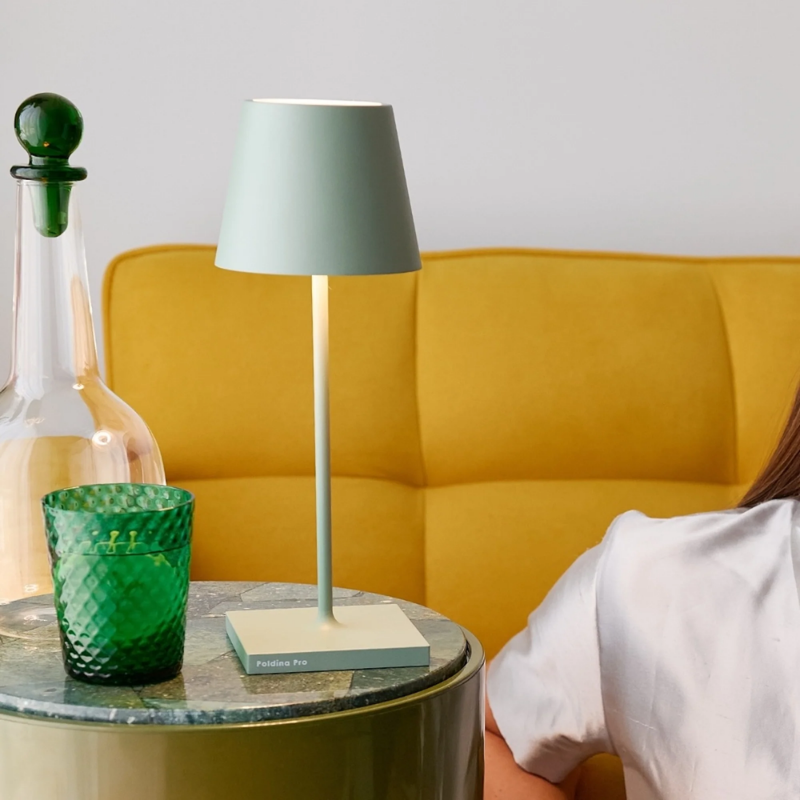 The sage Poldina Pro Mini from Zafferano in a living room.