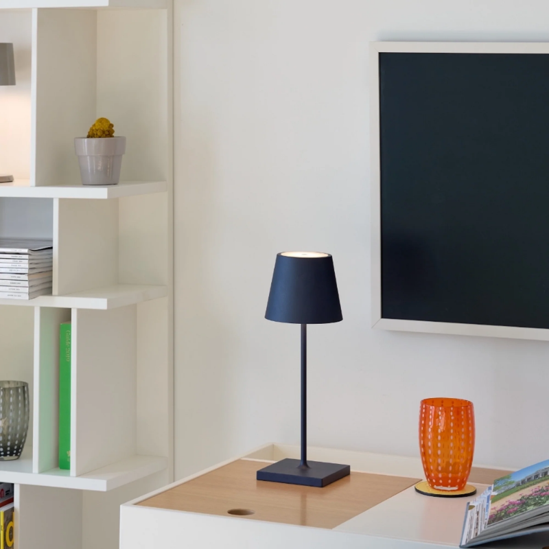 The steel blue Poldina Pro Mini from Zafferano in a tv room.