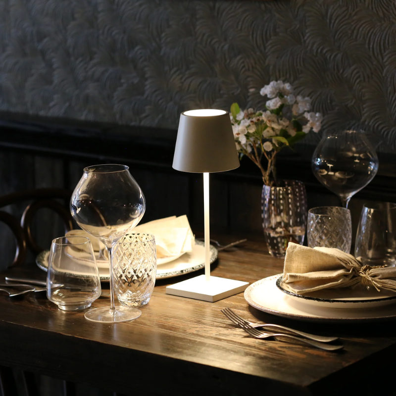 The white Poldina Pro Mini from Zafferano in a dining space.