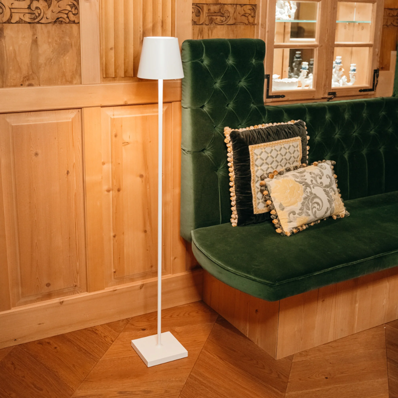 The white Poldina Pro L Floor Lamp from Zafferano in a living space.