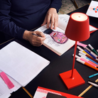 The red Poldina Pro from Zafferano in a home office.