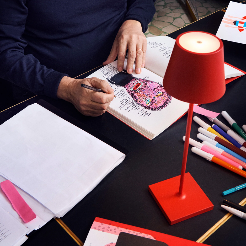 The red Poldina Pro from Zafferano in a home office.