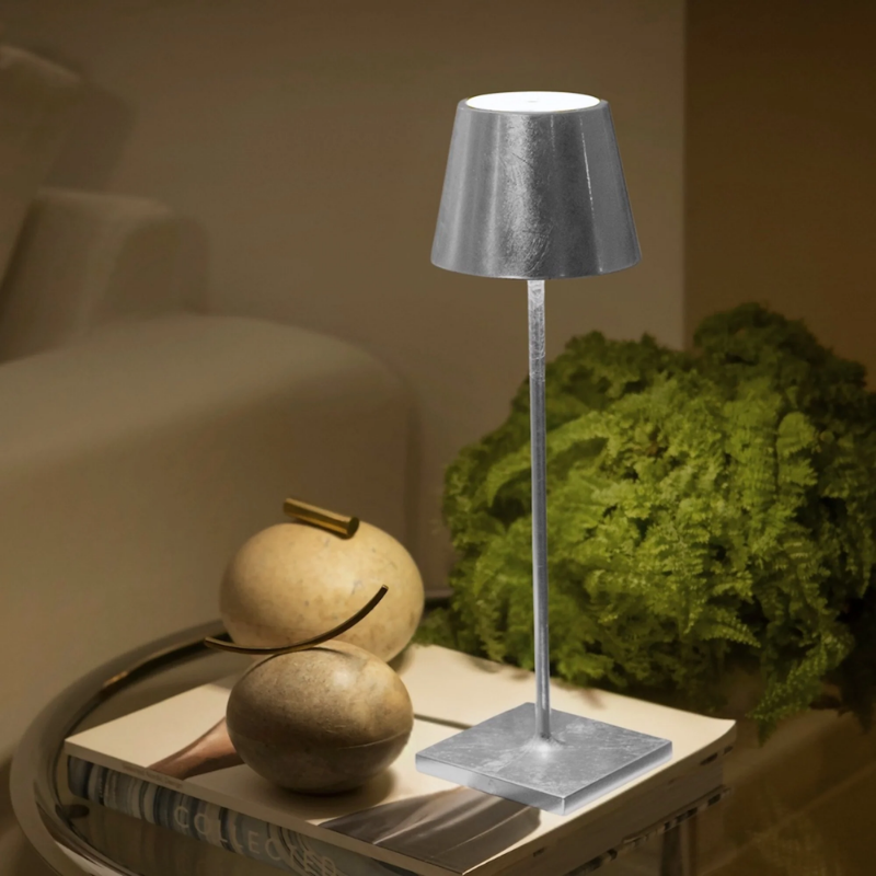 The silver leaf Poldina Pro from Zafferano in a living room.