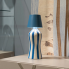 The avio blue Poldina Pro Stopper from Zafferano in a living space.