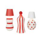 The red and the white Poldina Pro Stopper from Zafferano with decorative bottles in a studio. all-groups