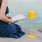 The sunflower Poldina Pro from Zafferano used as a reading lamp.