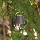 The dark gray Poldina Pro Suspension Magnetic from Zafferano in an outdoor space.