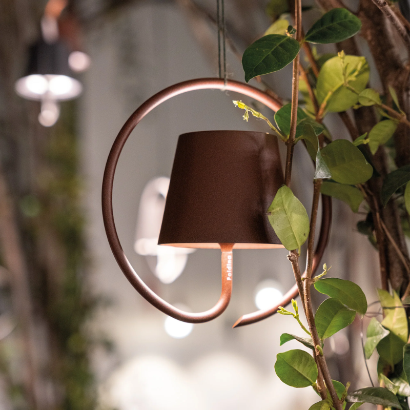 The rust Poldina Pro Suspension Magnetic from Zafferano in a living room.