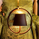 The rust Poldina Pro Suspension Magnetic from Zafferano in a lounge.